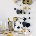 Detail of star and circle garland decorations with black and gold glitter hanging accents - Black Gold