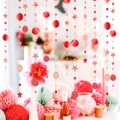 Close-up of sparkling red stars and glitter circle garlands for festive party decorations - Red