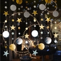 Detail of hanging star and circle garlands with metallic gold and silver mirror finishes - Gold and Silver Two-tone