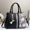 Borsa a mano da donna con ricami floreali e motivi geometrici in nero e grigio - Nero