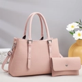 Detail of pink woven texture handbag with silver hardware and matching small wallet - Pink