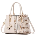 Elegant off-white handbag featuring floral embroidery and gold hardware detail - Off White