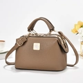 Detail of brown litchi pattern leather bag with triple zippers and gold logo plate - Khaki