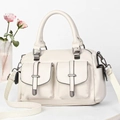 Detail of off-white lychee texture bag with dual pockets and woven shoulder strap - Off-white