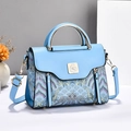 Sky blue crossbody handbag with traditional wave embroidery and metal bird clasp - Blue