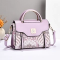 Purple leather handbag with Chinese style wave embroidery and golden bird logo - Purple