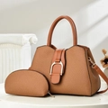 Brown woven texture tote bag set with metal buckle and shoulder strap on white pedestal - Earthy Yellow