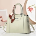 Close-up of mint green lychee grain leather bag with silk scarf and silver logo - 27/12/21 / Off-white