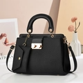 Chic black lizard pattern handbag with gold hardware and matching small coin purse charm - Black
