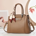 Elegant brown lychee leather handbag with silver logo and decorative silk scarf - 27/12/21 / Brown