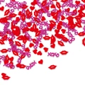 Macro shot of red hearts, lips and pink XOXO confetti for Valentine's party table decor - Dark Color Heart Lips Combination