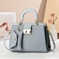 Grey-blue woven texture handbag with gold rotary lock and matching mini envelope pouch - Blue