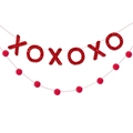 Close-up of red glitter XOXO banner and matching pom-pom garland for romantic party decor - Red XOXO Banner With Pom Pom String