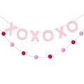 Detail of pink glitter XOXO letters and red soft pom-pom garland for party decor - Pink XOXO Banner With Pom Pom String