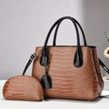 Detail of dark brown croco-embossed tote bag with matching small coin purse and gold hardware - Khaki/Earth Yellow