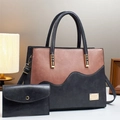 Detail view of contrast color tote bag set with metal brand plaque and leather texture - Pink and Grey