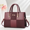 Elegant wine red handbag with color-block patchwork and adjustable shoulder strap - Burgundy