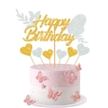 Close-up of golden Happy Birthday cake topper with pink butterflies and silver hearts - Gold + Silver