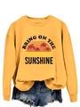 Detail of sunshine graphic print and palm tree design on a yellow crewneck sweatshirt - Yellow (Black Print)