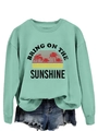 Detail of mint green sweatshirt with Bring On The Sunshine vintage palm tree print - Light Green (Black Graphic)