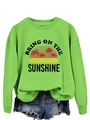 Detail of the sun and palm tree print on this green Bring On The Sunshine sweatshirt - Fluorescent Green (Black Graphic)