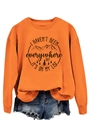 Detail of mountain forest print and slogan on orange crewneck sweatshirt fabric - Orange (Black Print)