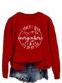 Detail of red crewneck sweatshirt featuring white mountain graphics and travel quote - Red (White Print)