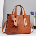 Orange-brown crocodile pattern handbag with top handles and adjustable shoulder strap - Earthy Yellow