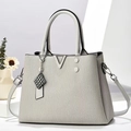 Elegant grey textured PU leather handbag with metallic V-detail and crossbody strap - Gray