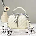 Cream quilted crossbody bag with metal bear charm and adjustable LOVE letter strap - Off-white