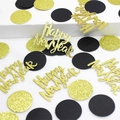 Macro shot of gold glitter Happy New Year confetti and black dots for party decor - Black Gold Circle and Gold Glitter Happy New Year Confetti