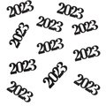 Detailed close-up of black 2023 cutout confetti for New Year Eve party table decoration - Black 2026 Confetti