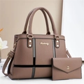 Detail of dark brown tote bag set with pebble leather texture and gold metal logo - Brown
