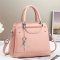 Close-up of pink lychee texture bag with silver star pendants and metallic rivets - L25 W11 H21 / Pink