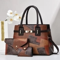 Detailed macro view of the three-piece handbag set with gold locks and patchwork design - Brown and Gray Color Scheme