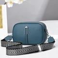 Navy blue pebble leather cross body bag with triple zip and chevron strap on white background - 21*8*14 / Blue