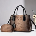 Brown crocodile pattern tote and pouch set with black handles and gold hardware - Brown