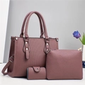 Detailed 3-piece mauve leather bag set featuring pebbled texture and vertical embossing - Purple