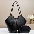 Detailed view of the 3-piece black tote bag set showing pebble leather texture - Three-Piece Set / Black