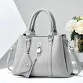 Detail of light grey pebbled leather handbag with metal padlock and mini envelope pouch - L29 W12 H21 / Gray