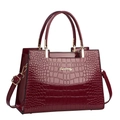 Dark red crocodile embossed patent leather handbag with gold hardware and strap - Burgundy