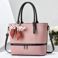 Detail of pink woven tote bag showing leopard silk scarf and dual zipper accents - Pink