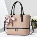 Detail of pink woven leather tote bag with elegant silk scarf and dark brown handles - Apricot