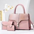 Detailed view of pink three-piece handbag set featuring lychee and croc pattern textures - Handbag/Clutch/Card Holder / Pink