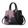 Elegant purple and black handbag for women featuring floral embroidery and plush charm - Color Block Dark Purple