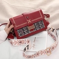 Elegant red tweed crossbody bag with gold hardware and stylish ethnic pattern wide strap - Red