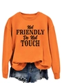 Close-up of orange sweatshirt with black 'Not FRIENDLY Do Not TOUCH' slogan print - S / Orange (Black Slogan)
