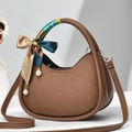 Close-up of brown litchi-grain PU leather semi-circle bag with silk scarf on handle - Dark Khaki