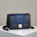 Fashionable crocodile texture crossbody chain bag with golden clover lock in blue and black - Blue