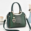 Dark green crocodile pattern handbag with gold metal handle and heart pendant charm - Green